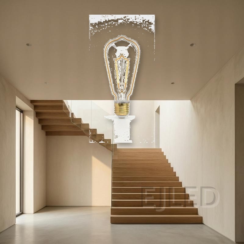 This clear glass ST64 bulb features an amber line LED filament inside a decorative pear-shaped glass envelope. It mounts with a standard threaded brass base for commercial lighting applications. - view 4