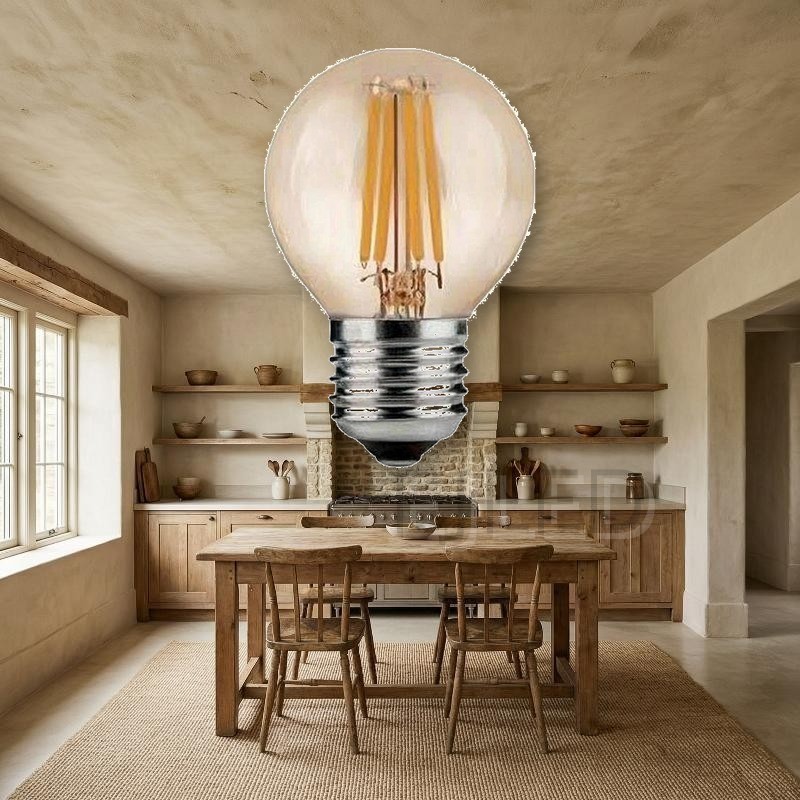 This compact globe lamp features vertical LED filaments inside a warm amber tinted glass sphere with a standard screw base, combining classic retro style with modern efficiency. - view 4