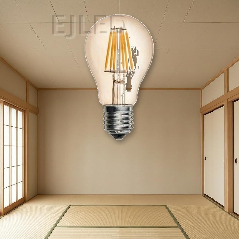 This retro LED filament light bulb features an amber-tinted glass shade and vertical LED filaments designed for vintage-style commercial and residential fixtures. - view 5