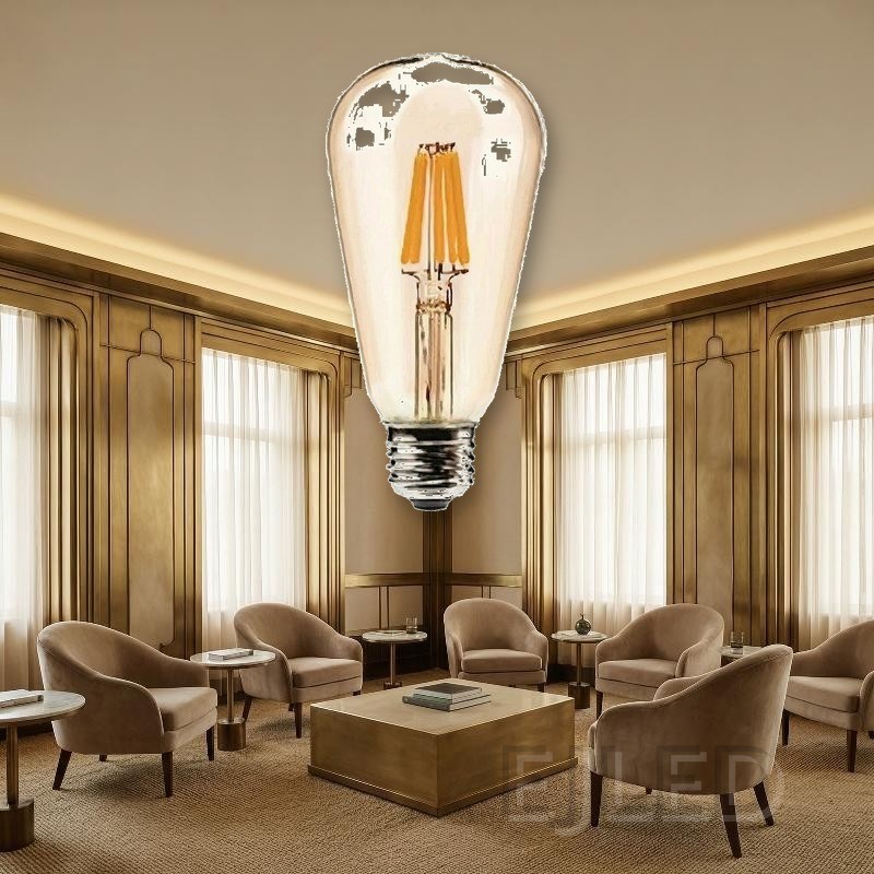 This clear glass teardrop lamp features visible LED filaments and a standard threaded metal screw base. It provides warm illumination for commercial and residential lighting projects. - view 5