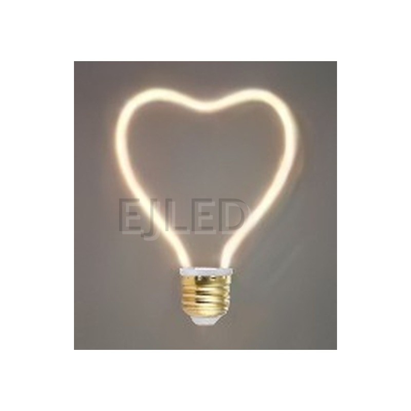This heart shaped LED filament bulb features a flexible curved light source mounted on a standard metallic screw base. - view 2