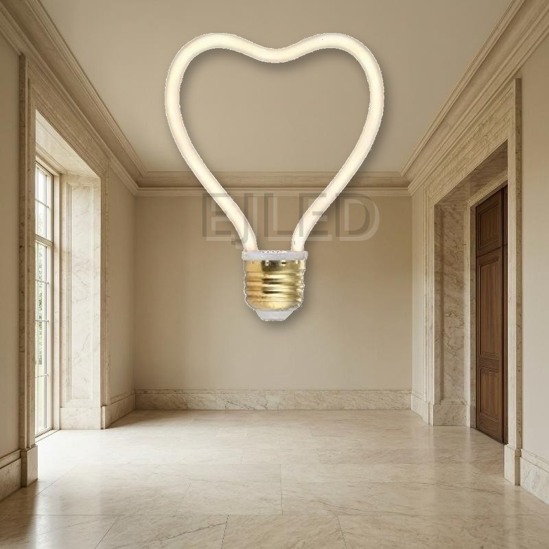 This heart shaped LED filament bulb features a flexible curved light source mounted on a standard metallic screw base. - view 4