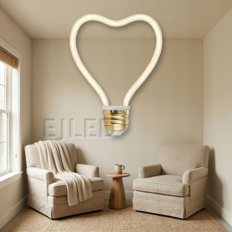 This heart shaped LED filament bulb features a flexible curved light source mounted on a standard metallic screw base. - view 5