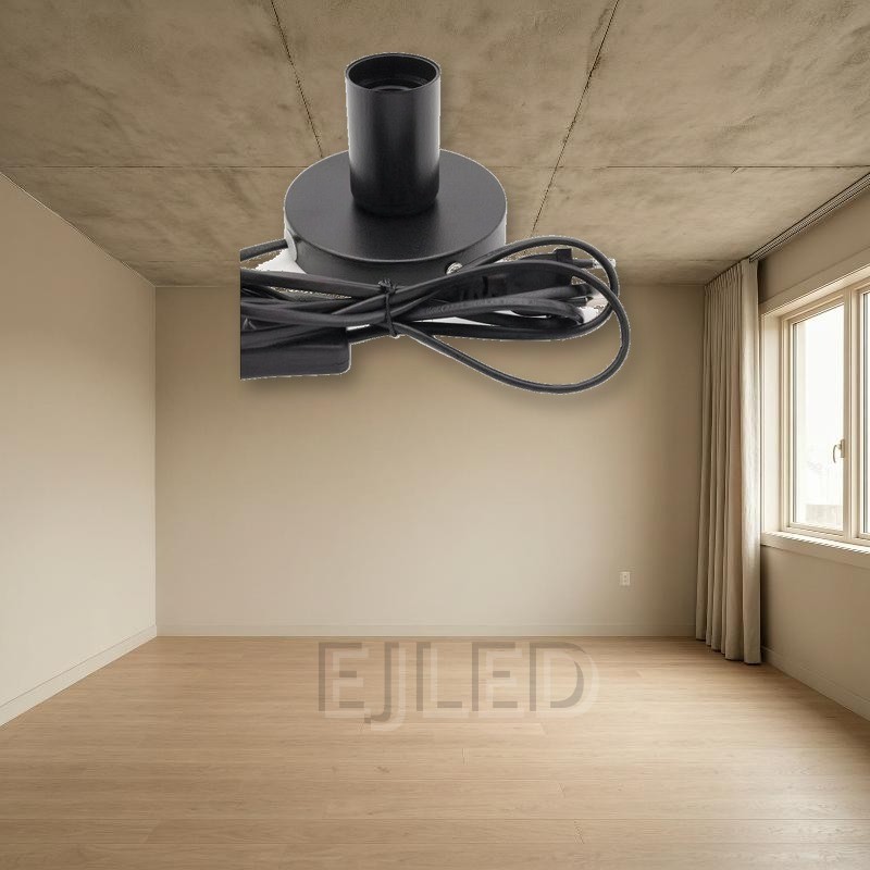 This black metal table lamp base features a cylindrical socket mounted on a round base, complete with an attached power cord, inline switch, and plug. - view 4