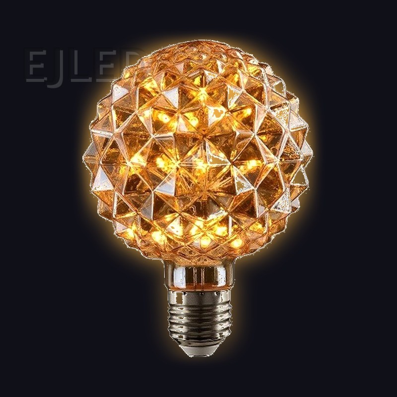 This amber glass bulb features a spherical shape with faceted crystal details and an Edison screw base, powered by interior LED lights. - view 2