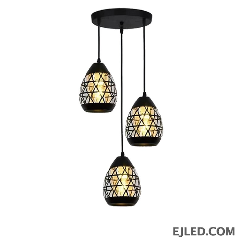 Constructed from black-finished iron, this geometric pendant light features an open, hexagonal cage design. It showcases a single exposed lamp, delivering ambient illumination in a modern industrial aesthetic.