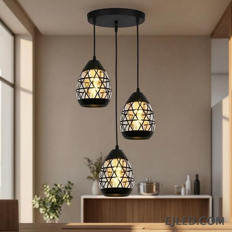 Constructed from black-finished iron, this geometric pendant light features an open, hexagonal cage design. It showcases a single exposed lamp, delivering ambient illumination in a modern industrial aesthetic. - view 2