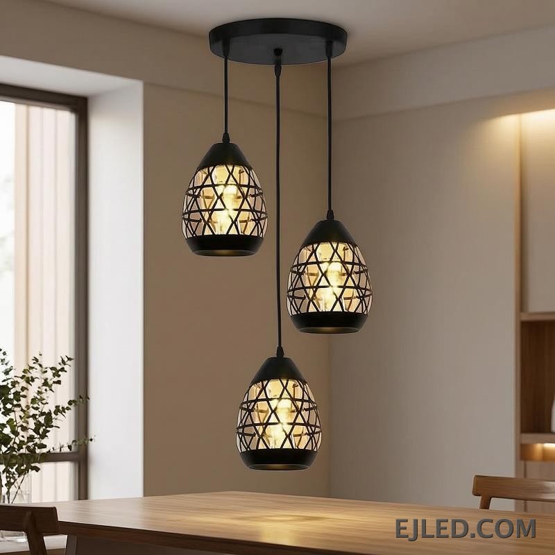 Constructed from black-finished iron, this geometric pendant light features an open, hexagonal cage design. It showcases a single exposed lamp, delivering ambient illumination in a modern industrial aesthetic. - view 4