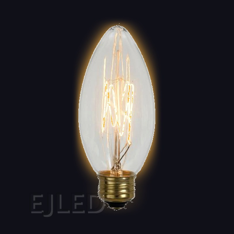 This incandescent bulb features a pointed candle shade in clear glass and a brass screw base, housing a visible tungsten filament. Model C35L-40W. - view 2