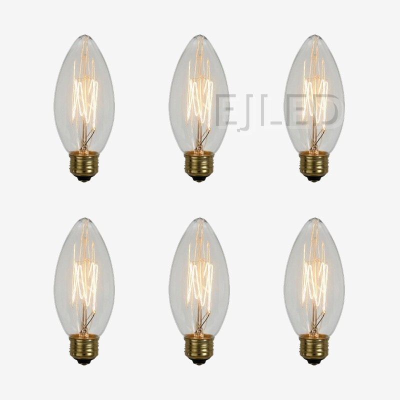 This incandescent bulb features a pointed candle shade in clear glass and a brass screw base, housing a visible tungsten filament. Model C35L-40W. - view 5