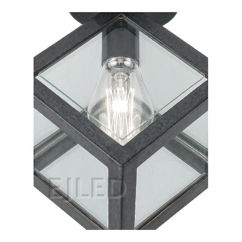 This black metal ceiling light features a geometric cube shade with glass panels and a single exposed vintage-style LED bulb. - view 3