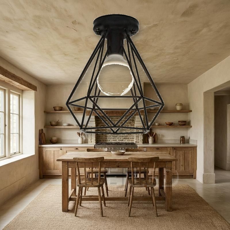 This black metal ceiling light features a geometric wire cage shade that exposes a single lamp. It mounts directly to the ceiling for a clean industrial look. - view 5