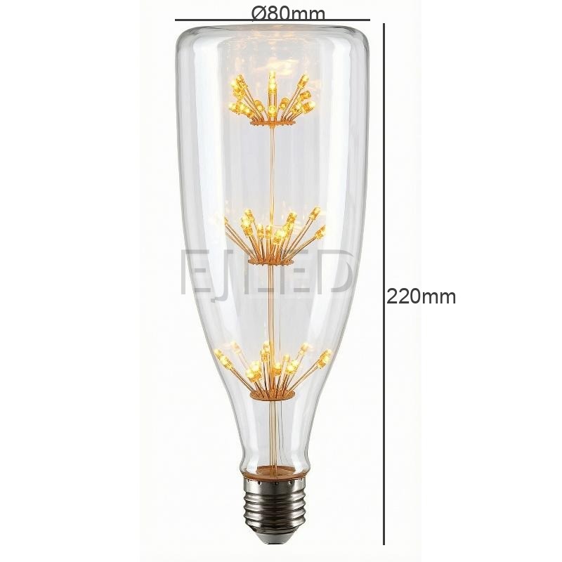 This clear glass starry LED bulb features a tall bottle shape and three vertical tiers of delicate firework style filaments connected to a standard screw base. - view 4