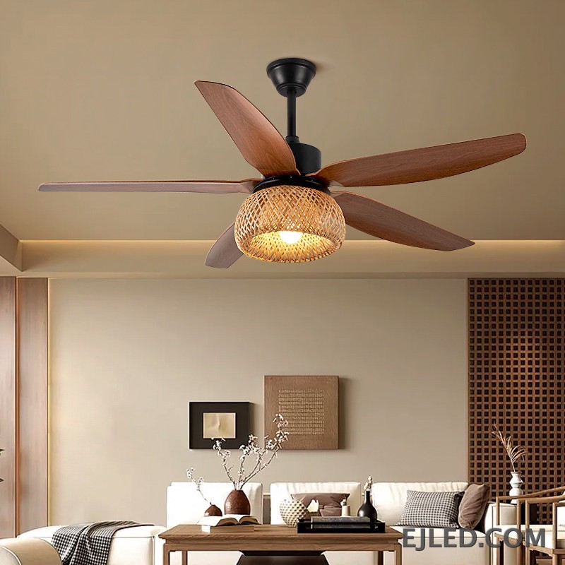 This ceiling fan light features five blades with a dark wood finish and a matte black ABS body. It includes a single light source housed within a spherical, open-weave rattan shade. - view 4