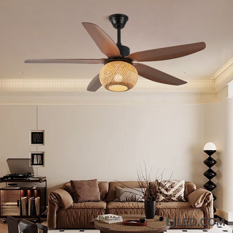 This ceiling fan light features five blades with a dark wood finish and a matte black ABS body. It includes a single light source housed within a spherical, open-weave rattan shade. - view 5