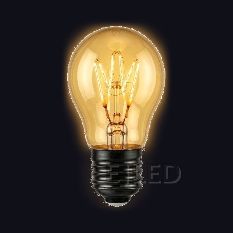 This amber glass soft filament LED bulb features a warm golden finish and a compact globe shape for decorative interior lighting fixtures. - view 2