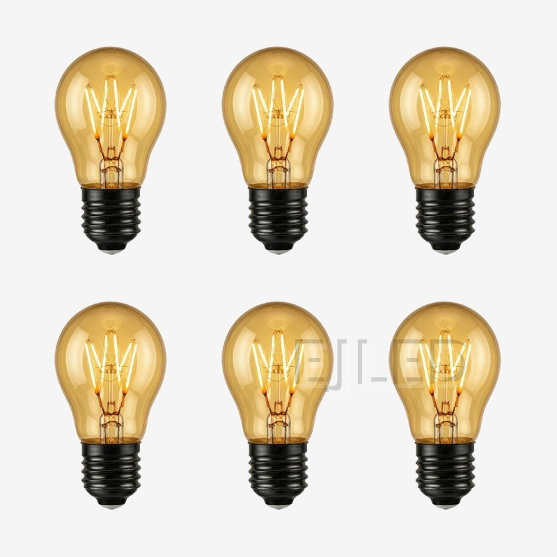 This amber glass soft filament LED bulb features a warm golden finish and a compact globe shape for decorative interior lighting fixtures. - view 5