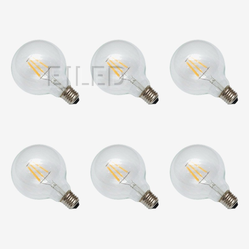 This G95-FL vintage filament bulb features a round clear glass shade and exposed yellow LED filaments, offering a classic look for decorative commercial and residential lighting projects. - view 5
