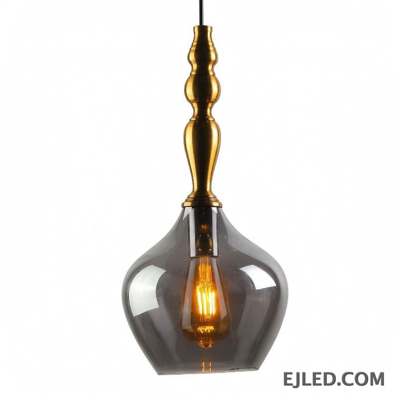 A glass pendant light, the GL0006 features a clear, spherical shade suspended from a brass fitting. Its open design allows for ample light distribution, making it suitable for general illumination or to highlight specific areas with an exposed bulb.