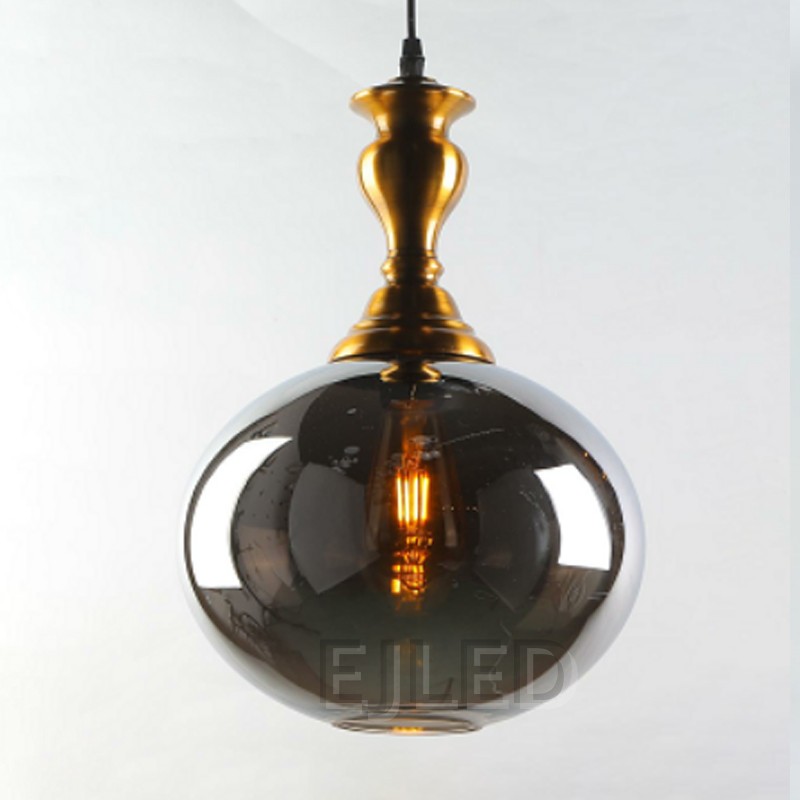 This pendant light features a smoke-tinted glass globe shade suspended below a decorative brass finish metal fixture body. An exposed filament LED bulb illuminates the interior. - view 2