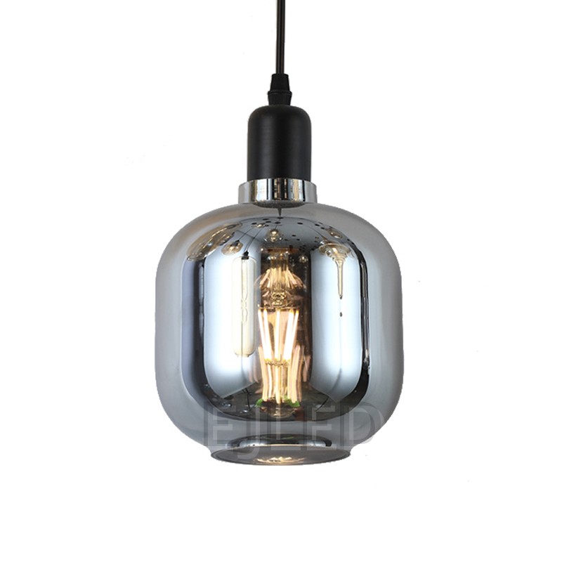 This amber tinted glass round pendant lamp features a visible vintage LED filament bulb inside an enclosed glass shade suspended by a black cord. - view 4