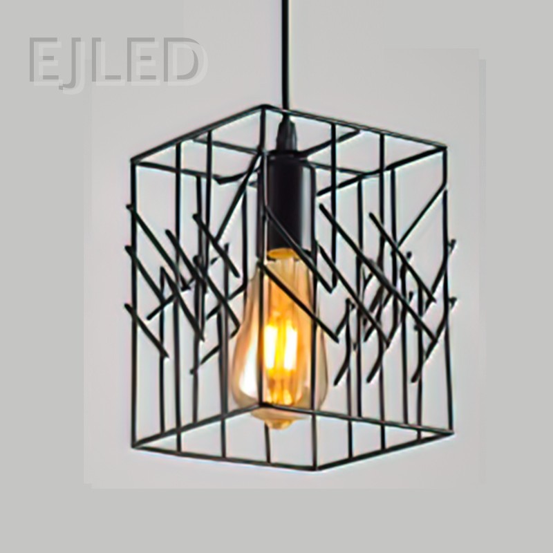 This black iron pendant light features an open geometric cube shade surrounding a single exposed bulb. It hangs from a black cord for a modern industrial look. - view 2