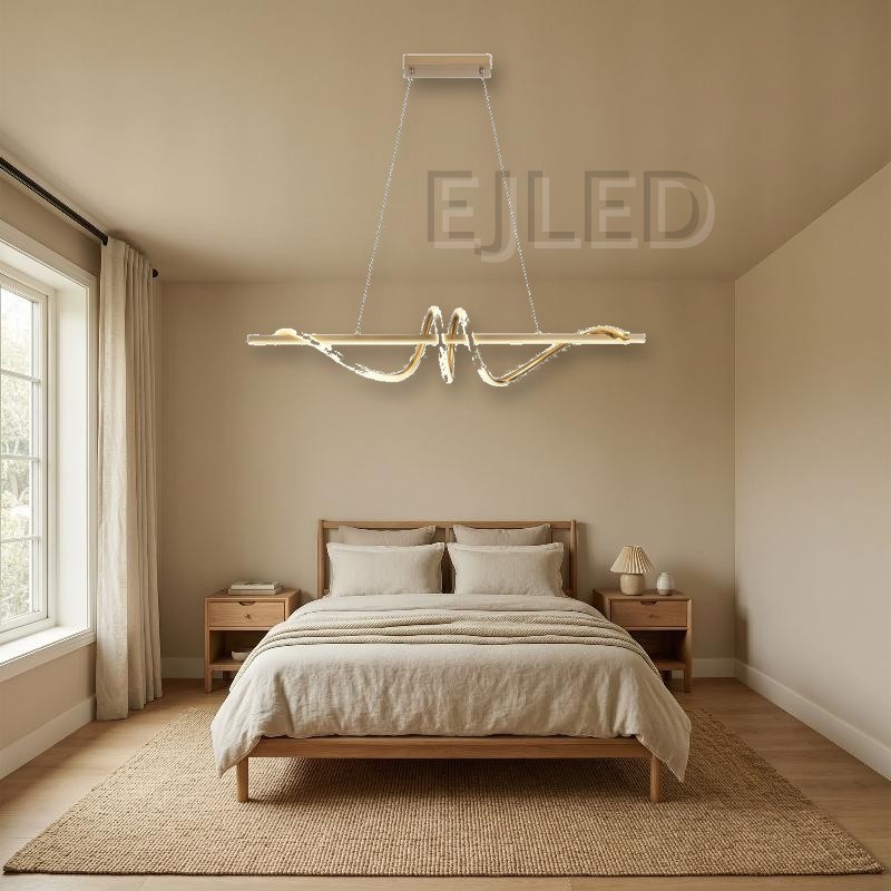 This modern golden pendant light features a linear metal frame intersected by a sculptural illuminated loop element. It suspends from a matching rectangular canopy by thin cables. - view 4
