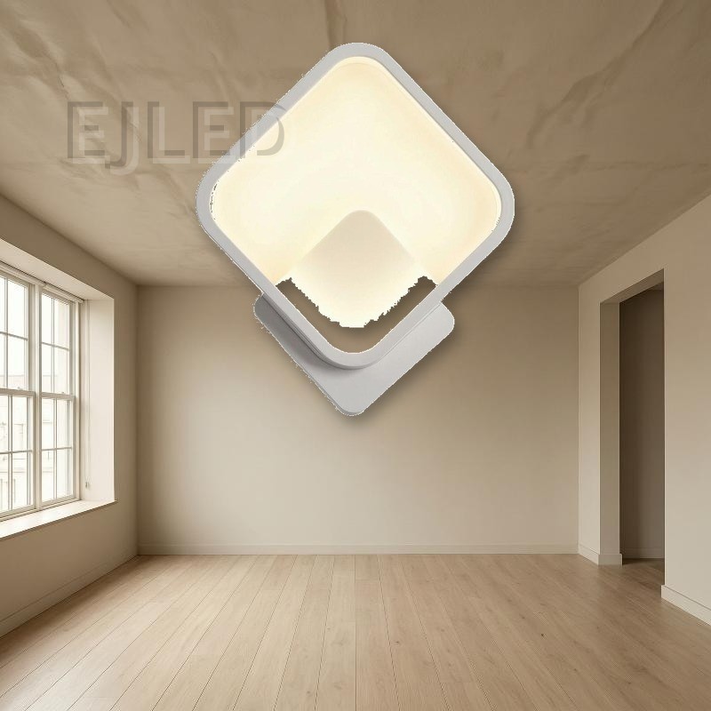 This modern diamond LED wall sconce features a geometric square shade angled on a matching base, casting soft illumination through an enclosed diffuser. Ideal for commercial and residential interiors. - view 5