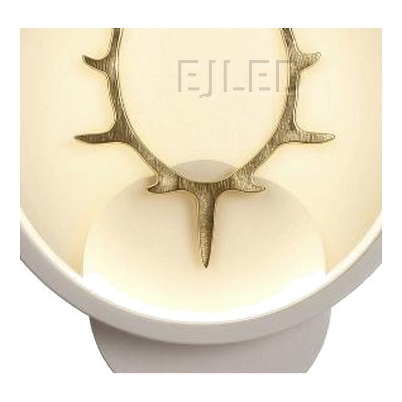 This modern antler LED wall light features a circular shade with a gold finish deer motif, providing warm illumination for hospitality and residential interior projects. - view 3