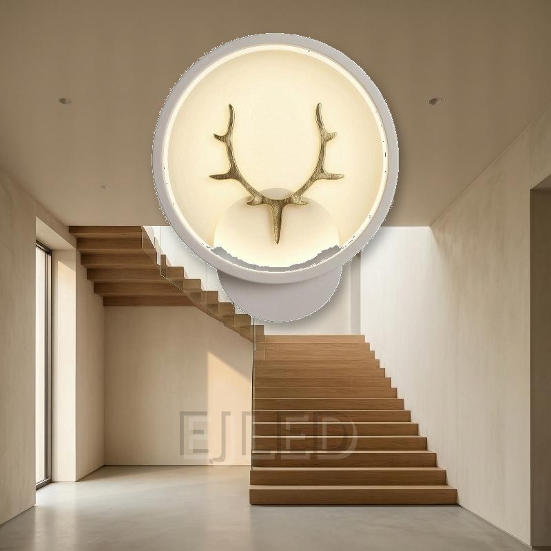 This modern antler LED wall light features a circular shade with a gold finish deer motif, providing warm illumination for hospitality and residential interior projects. - view 4