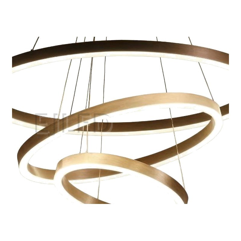 Three nested aluminum rings suspend at staggered angles from adjustable steel cables, combining brushed metallic finishes with continuous internal LED illumination. - view 3