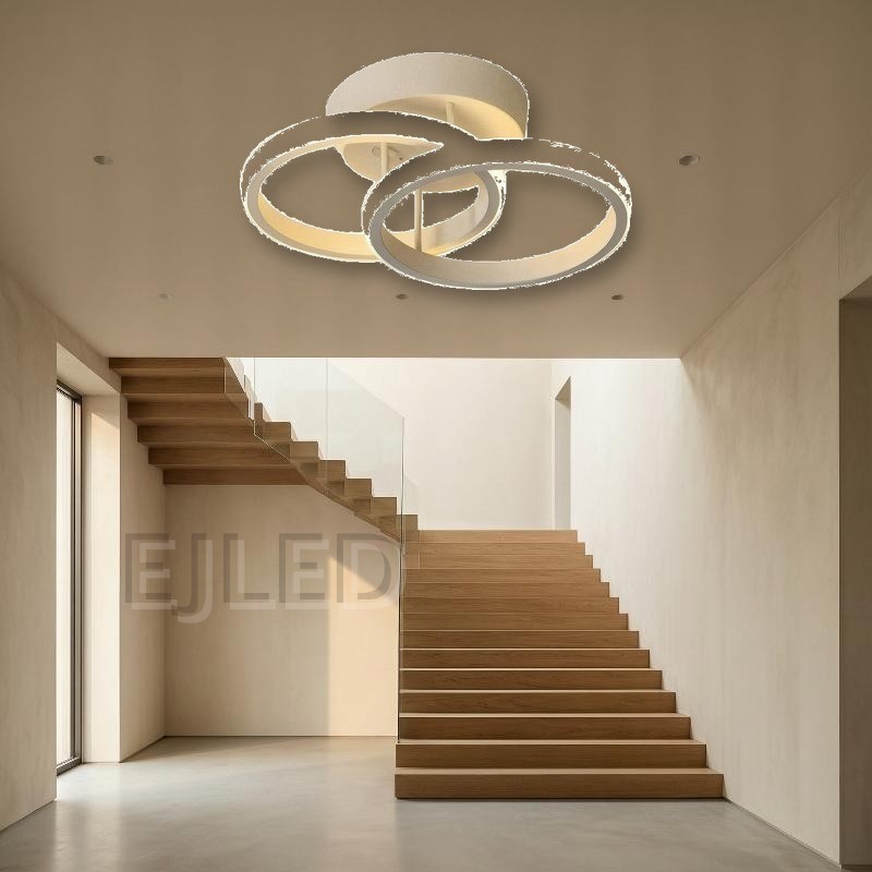 This LED ceiling light features three open circular rings arranged in an overlapping layout on a round base. The white finish creates a clean lighting fixture. - view 5