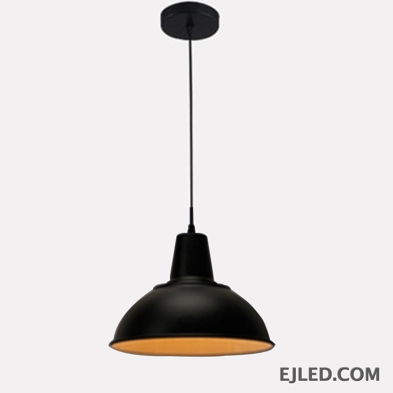 The MK0001 barn pendant light features a robust steel dome shade with a matte black exterior and a white interior, directing downward light from a single lamp. It suspends from a matching black cord and canopy.