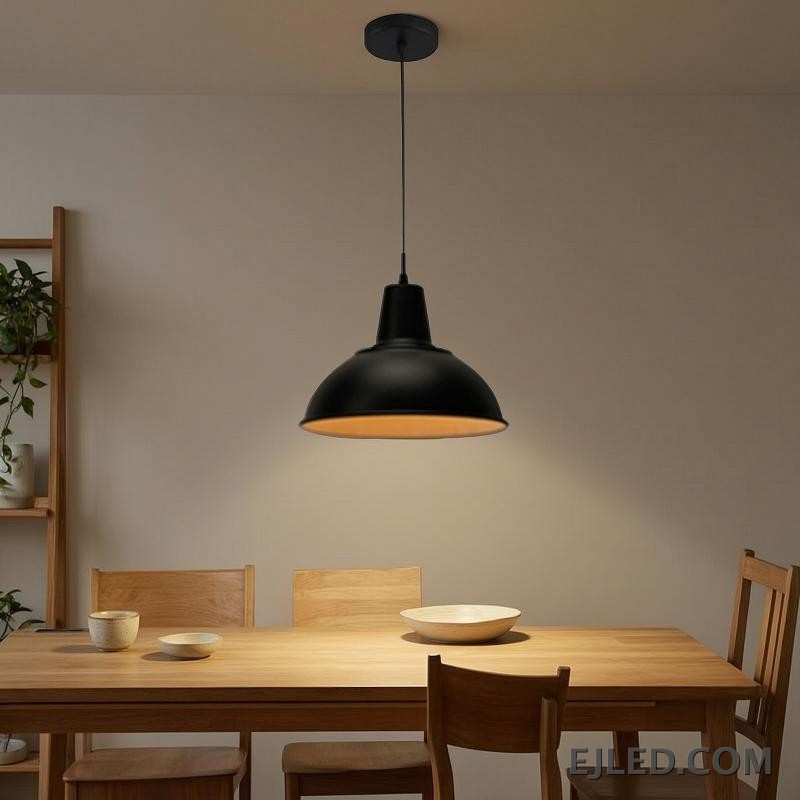 The MK0001 barn pendant light features a robust steel dome shade with a matte black exterior and a white interior, directing downward light from a single lamp. It suspends from a matching black cord and canopy. - view 6