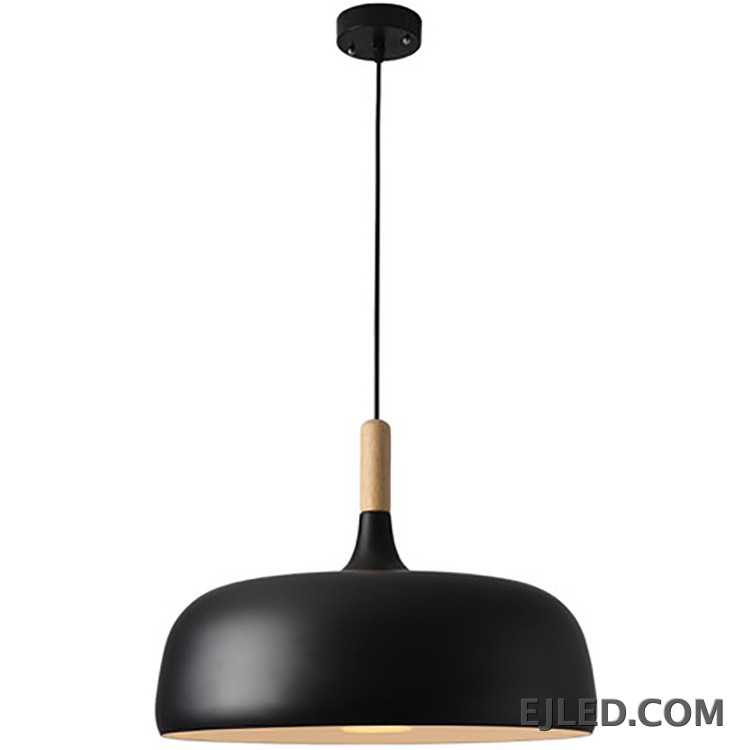 The MK0005 barn pendant light is a classic bell-shaped fixture with a matte black metal exterior and a white interior. It provides focused downward illumination from a single lamp, suspended by a black cable and canopy. - view 2