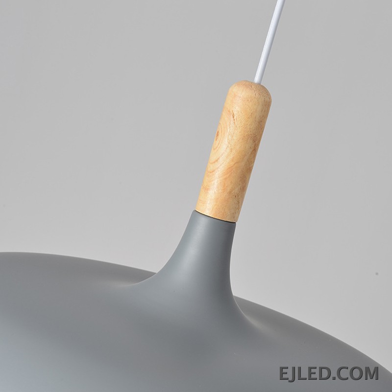 The MK0005 barn pendant light is a classic bell-shaped fixture with a matte black metal exterior and a white interior. It provides focused downward illumination from a single lamp, suspended by a black cable and canopy. - view 3