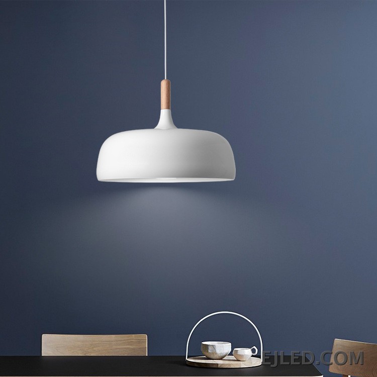 The MK0005 barn pendant light is a classic bell-shaped fixture with a matte black metal exterior and a white interior. It provides focused downward illumination from a single lamp, suspended by a black cable and canopy. - view 4