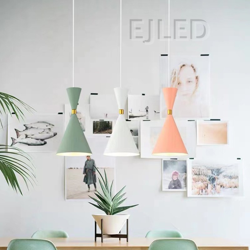 This unique pendant lamp features a black plastic body in an hourglass shape, accented by a gold-tone band. It provides downward illumination, suspended by a single cord, making it suitable for various interior settings. - view 5
