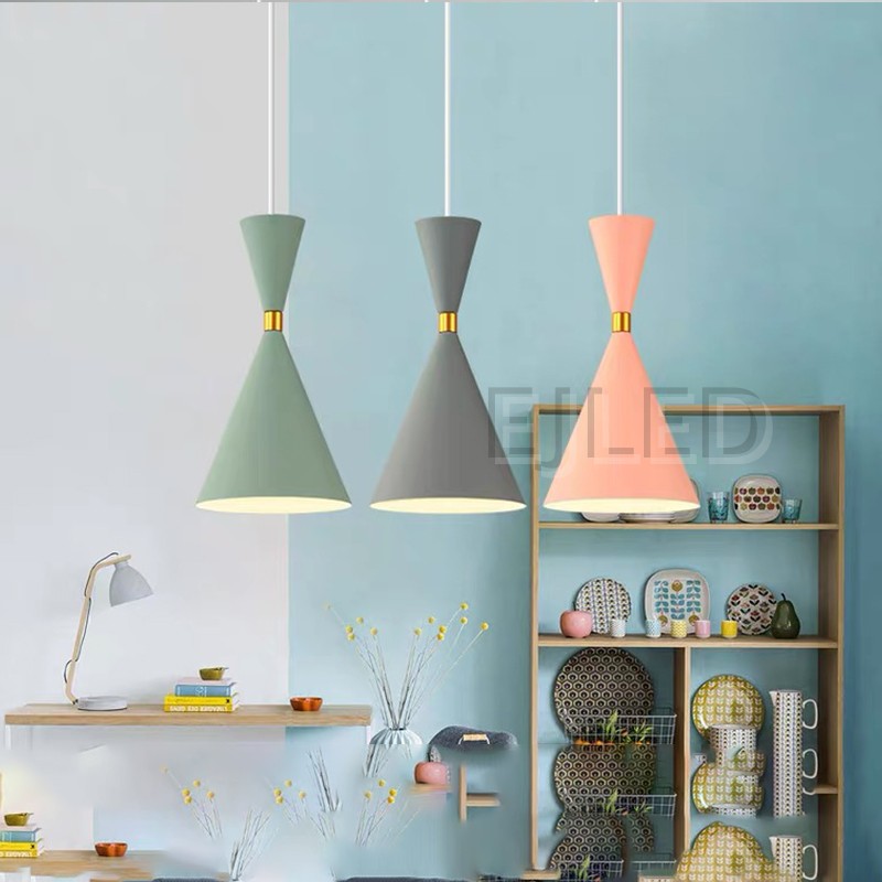 This unique pendant lamp features a black plastic body in an hourglass shape, accented by a gold-tone band. It provides downward illumination, suspended by a single cord, making it suitable for various interior settings. - view 6