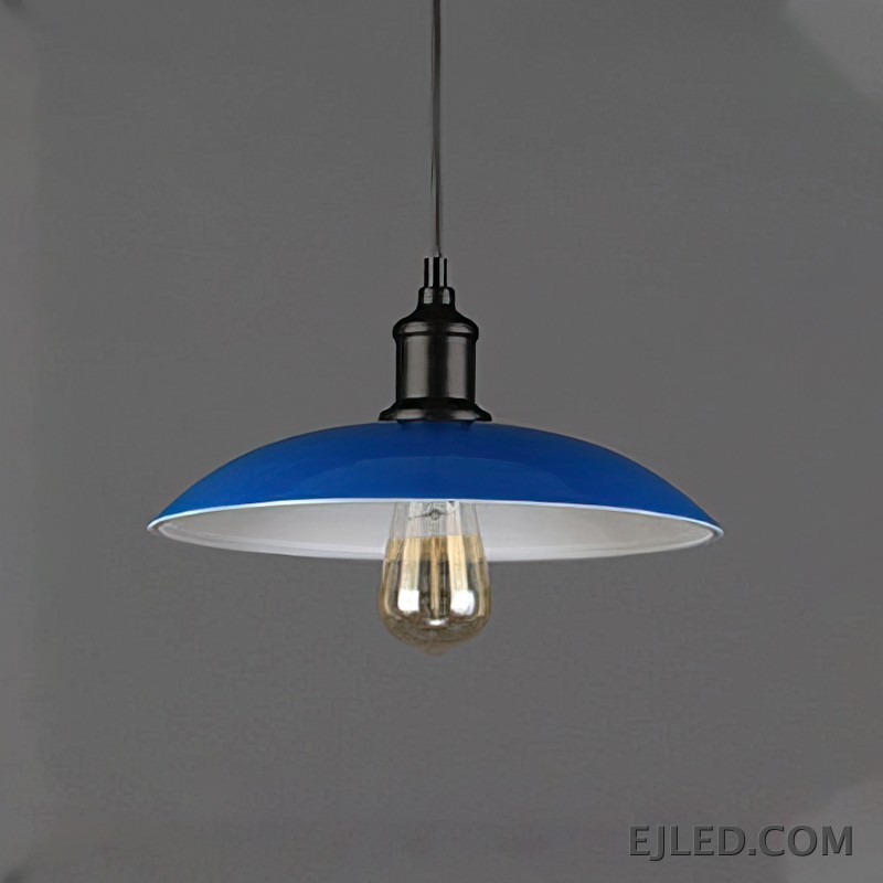 This iron dome pendant lamp features a matte black exterior shade and a reflective interior. It suspends from a black cord and illuminates with a single, exposed bulb. The fixture has a dark, textured finish on its connecting hardware. - view 3