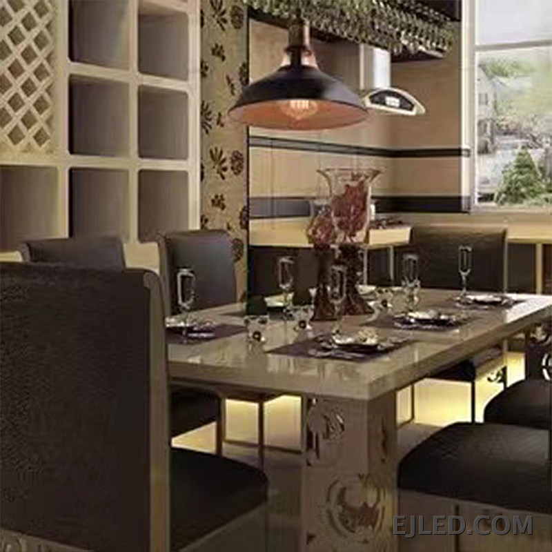 This dome pendant light features a matte black steel shade with an open bottom, revealing a single bulb and a light-colored interior for broad illumination. It hangs from a simple suspension cord. - view 3