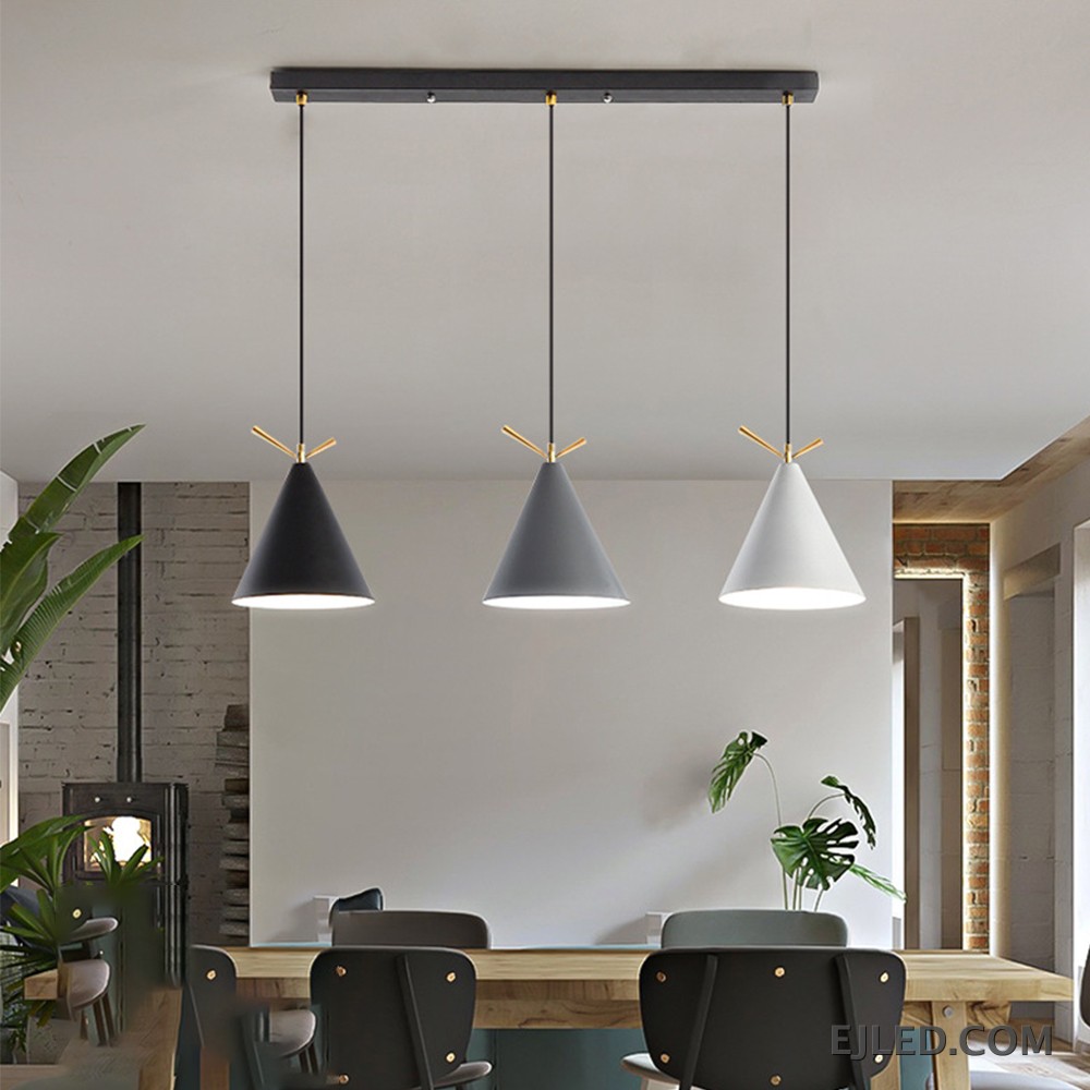 This pendant fixture features three cone-shaped metal shades in white, gray, and black, each accented with gold-colored details and an open bottom. It hangs from a single black circular canopy. - view 4