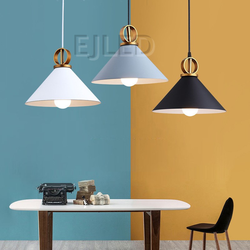 This black and brass metal bell pendant light hangs from a black cord and features a distinct ring accent above the shade for architectural interest. - view 6