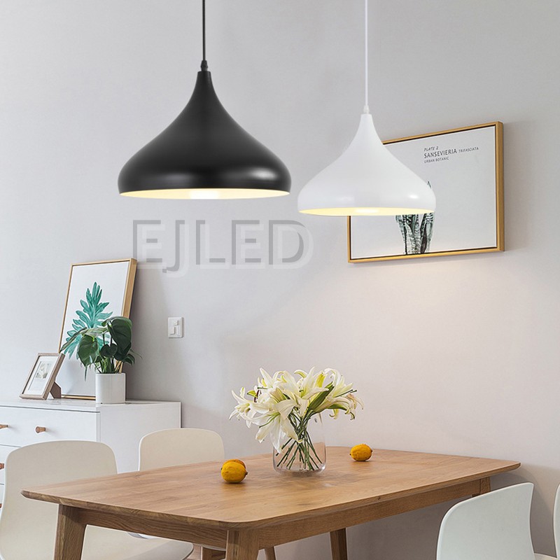 This black steel pendant lamp features a distinct metal dome shape and hangs by a matching black cord from a round ceiling canopy. - view 4