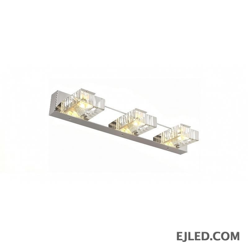 This triple-head crystal mirror lamp features three individual crystal shades, set on a polished chrome stainless steel base, ideal for task lighting over mirrors.