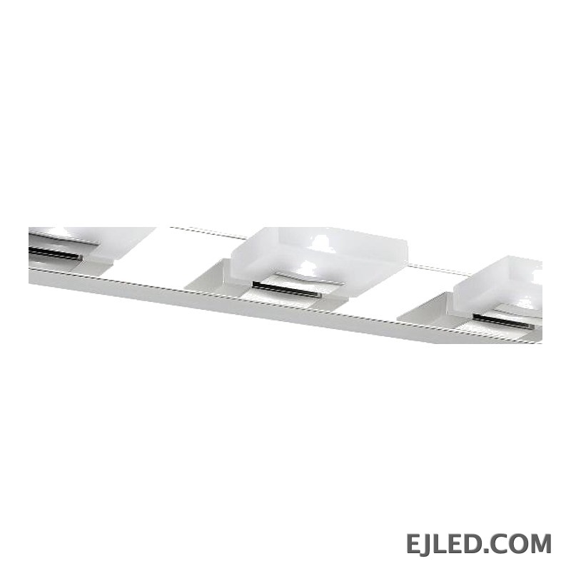 Una lámpara de espejo vertical de acero inoxidable con acabado cromado presenta tres cabezales de luz rectangulares individuales, cada uno con un difusor de acrílico blanco opaco. Su silueta limpia y vertical proporciona iluminación enfocada para áreas de trabajo en diversos entornos. - view 3