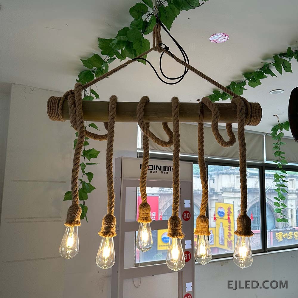 This multi-light hemp rope chandelier features a horizontal bamboo body with five exposed bulbs suspended by braided ropes, offering a rustic aesthetic. - view 5