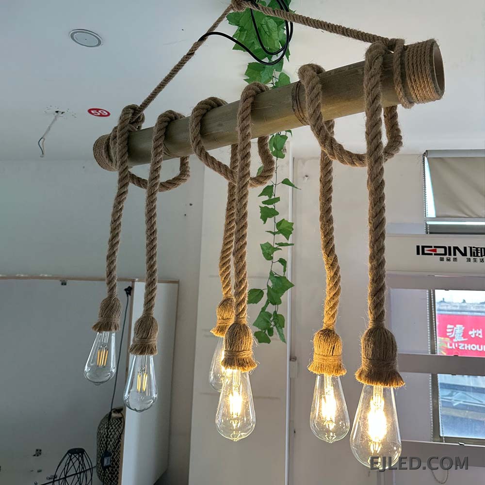 This multi-light hemp rope chandelier features a horizontal bamboo body with five exposed bulbs suspended by braided ropes, offering a rustic aesthetic. - view 6