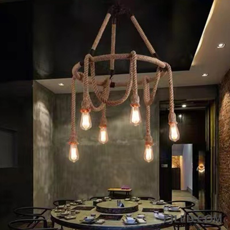A unique hemp rope chandelier presenting five exposed glass lamps, suspended by rope from a central chain. This fixture features a natural rope finish and a rustic design. - view 5