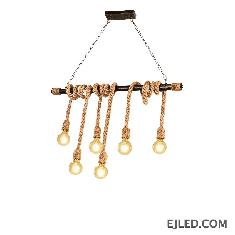 This six-light chandelier features a linear steel bar wrapped with natural hemp rope, suspending exposed bulbs. Two chains connect it to a rectangular ceiling plate, offering a distinctive, open aesthetic.